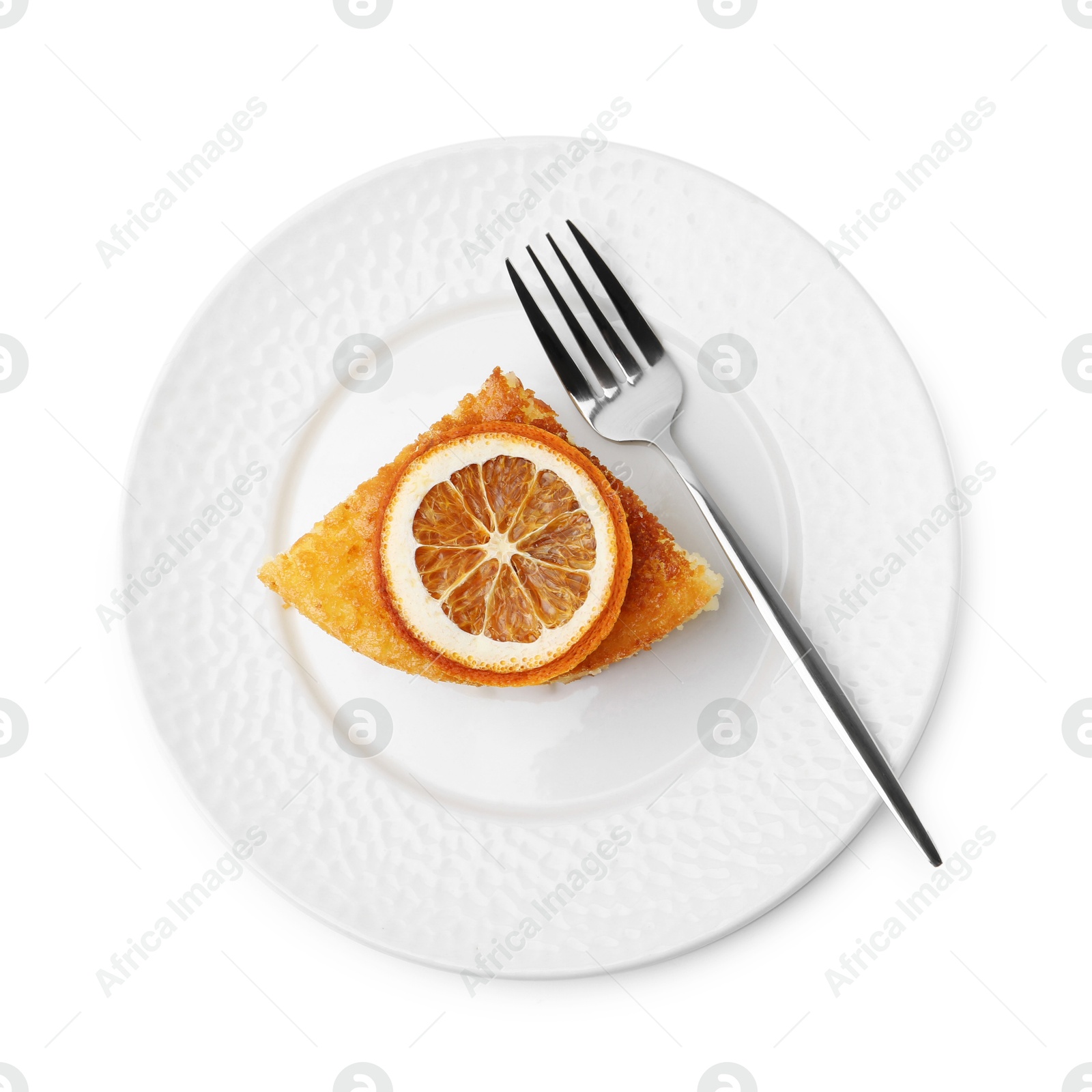 Photo of Slice of tasty homemade semolina cake and fork isolated on white, top view