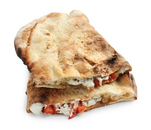 Photo of Halves of tasty calzone with meat, cheese, sauce and tomato isolated on white