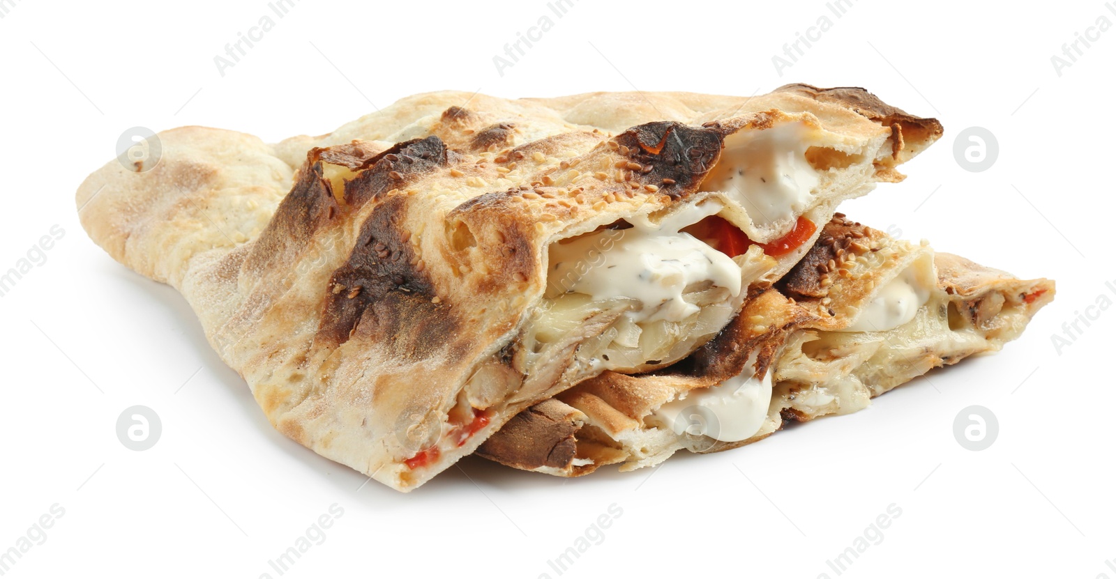 Photo of Halves of tasty calzone with meat, cheese, sauce and tomato isolated on white