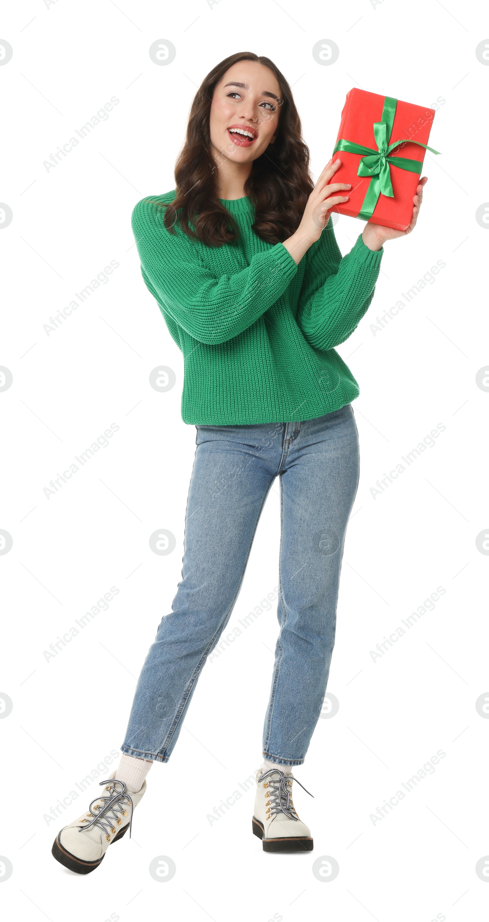 Photo of Beautiful young woman with Christmas gift isolated on white