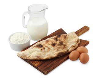 Photo of Delicious calzone and ingredients isolated on white