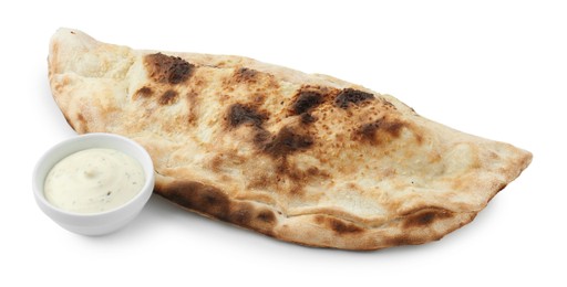 One delicious calzone with sauce isolated on white