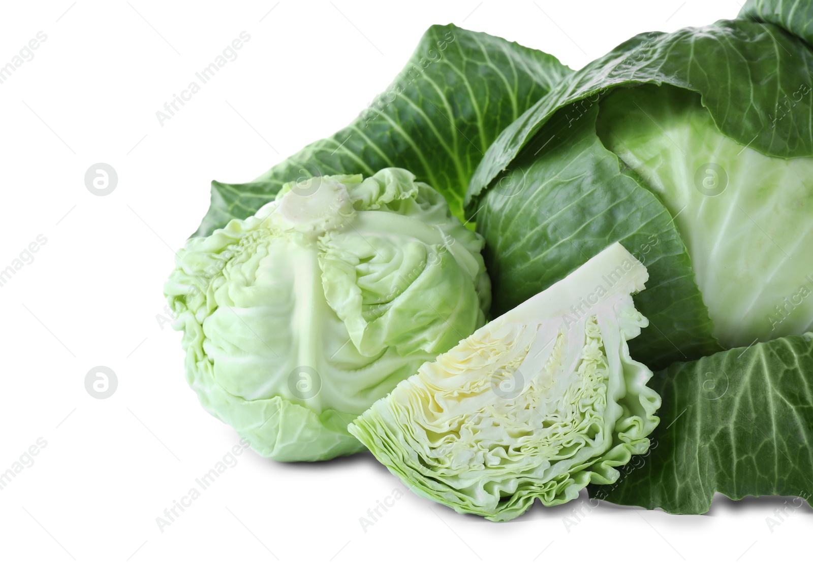 Photo of Whole and cut cabbages isolated on white