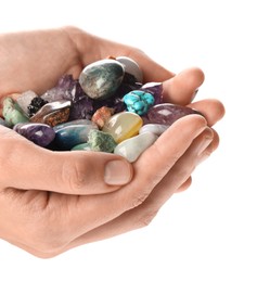 Photo of Woman holding different natural mineral stones on white background, closeup