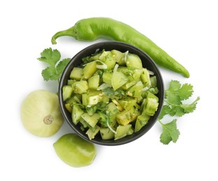 Photo of Delicious homemade green salsa and ingredients isolated on white, top view