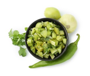 Photo of Delicious homemade green salsa and ingredients isolated on white, top view