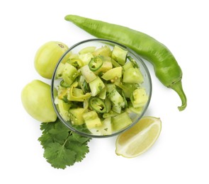 Photo of Delicious homemade green salsa and ingredients isolated on white, top view