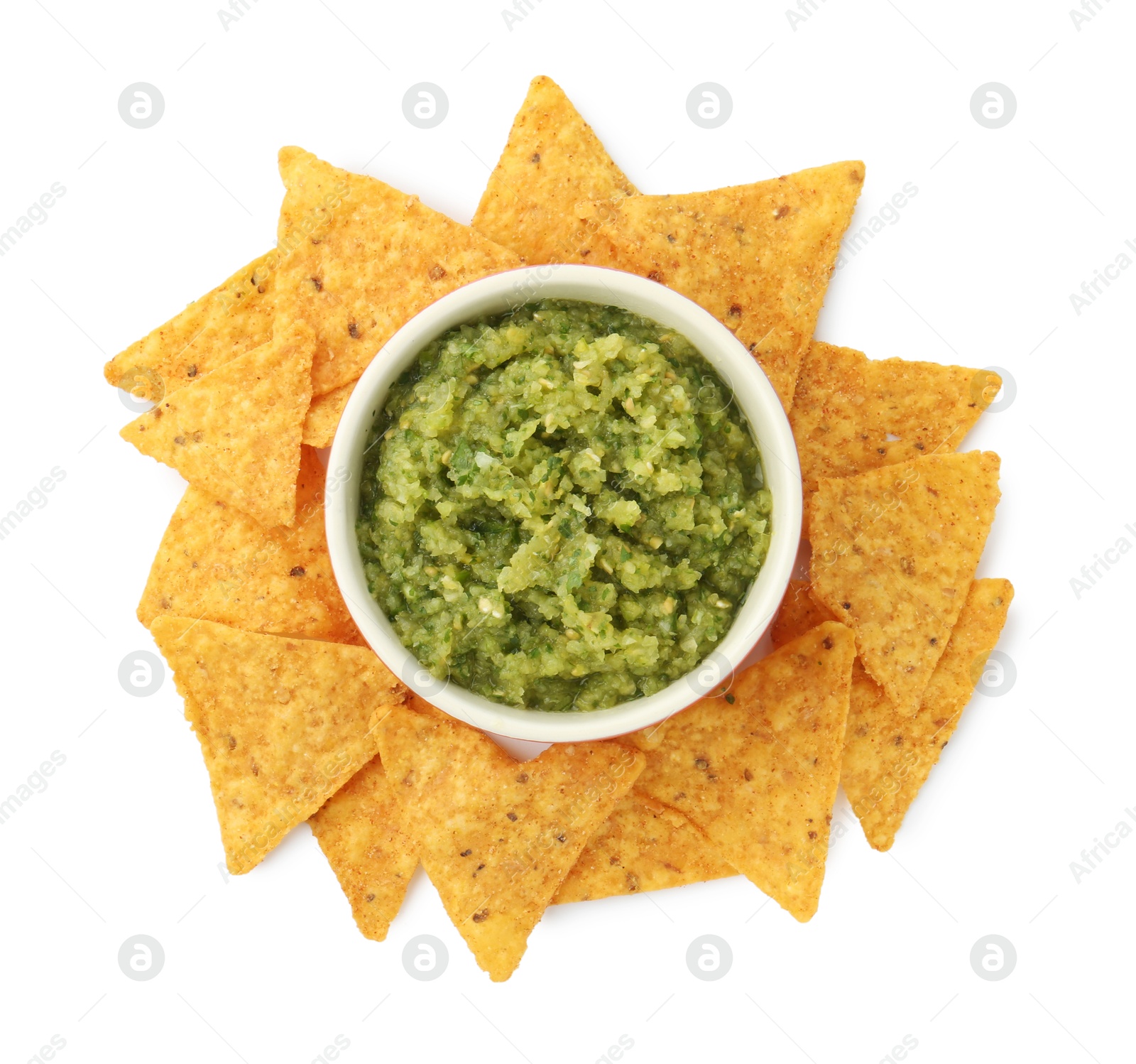 Photo of Delicious homemade green salsa with nachos isolated on white, top view