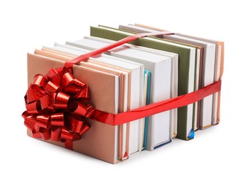 Photo of Books with red bow as gift isolated on white