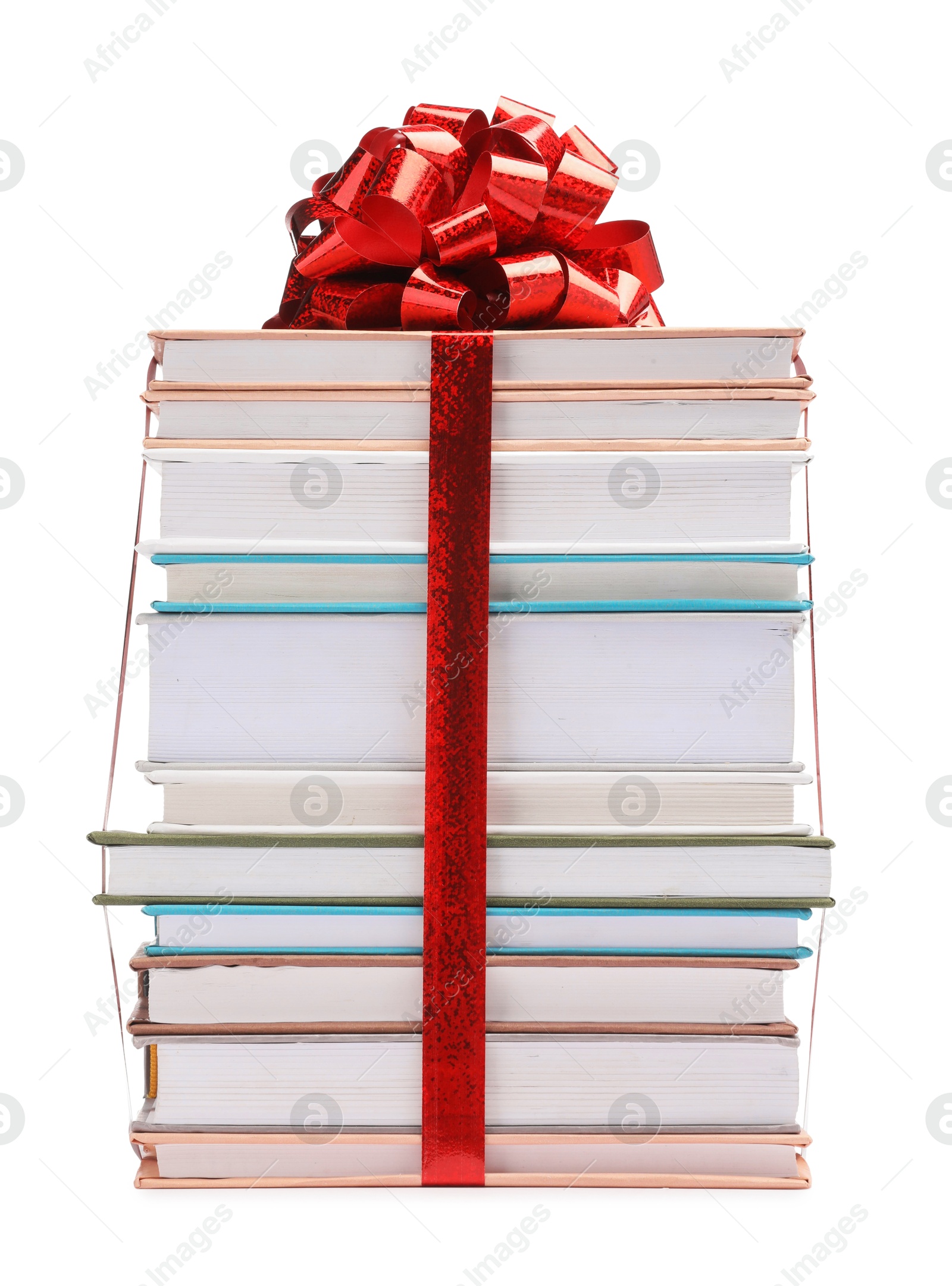 Photo of Stack of books with red bow as gift isolated on white