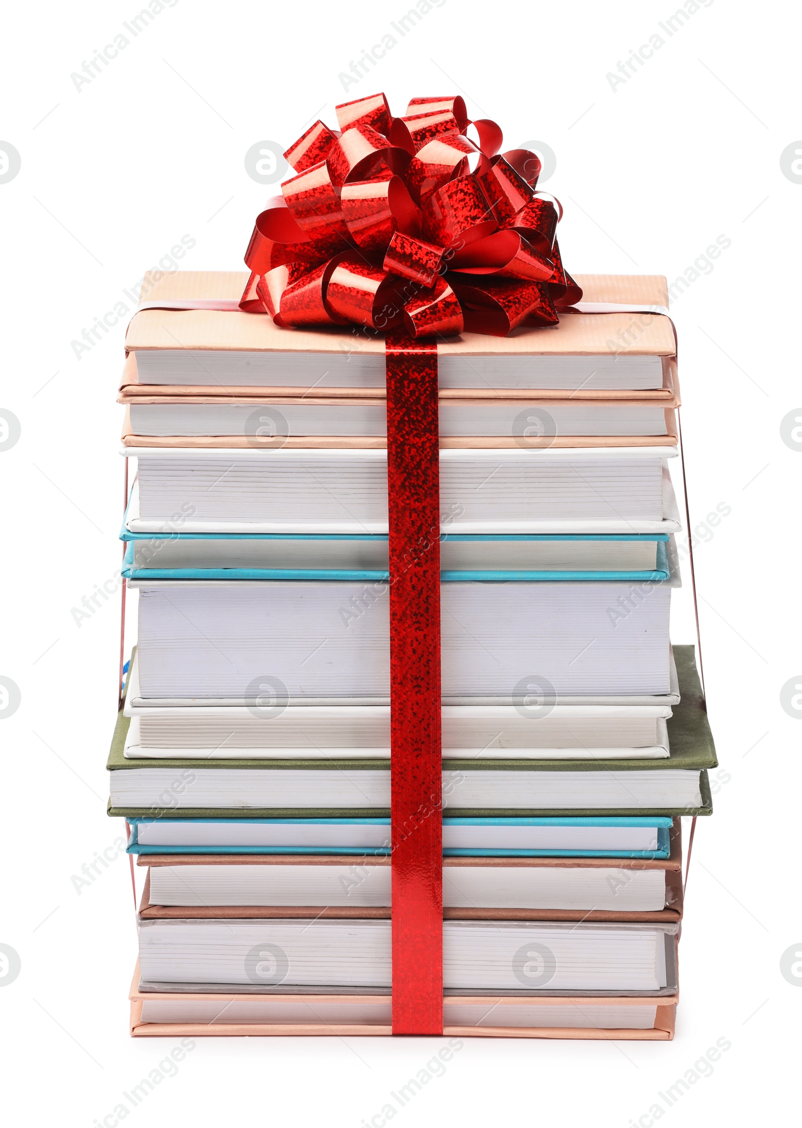 Photo of Stack of books with red bow as gift isolated on white