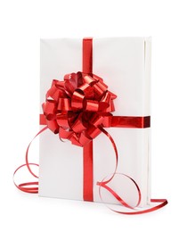 Photo of One book with red bow as gift isolated on white