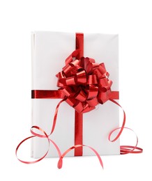 Photo of One book with red bow as gift isolated on white