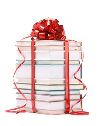 Photo of Stack of books with red bow as gift isolated on white