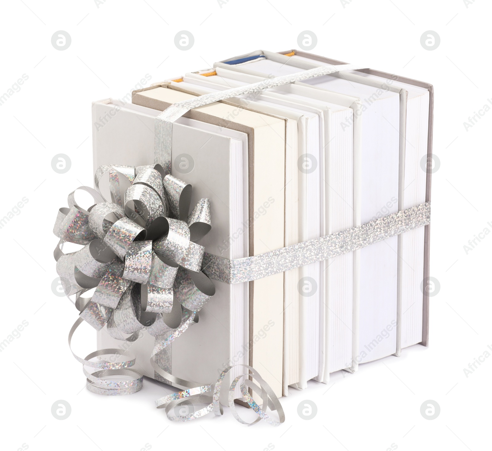 Photo of Books with silver bow as gift isolated on white