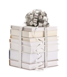 Photo of Stack of books with silver bow as gift isolated on white