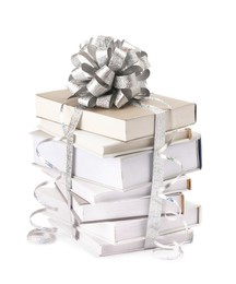 Photo of Stack of books with silver bow as gift isolated on white