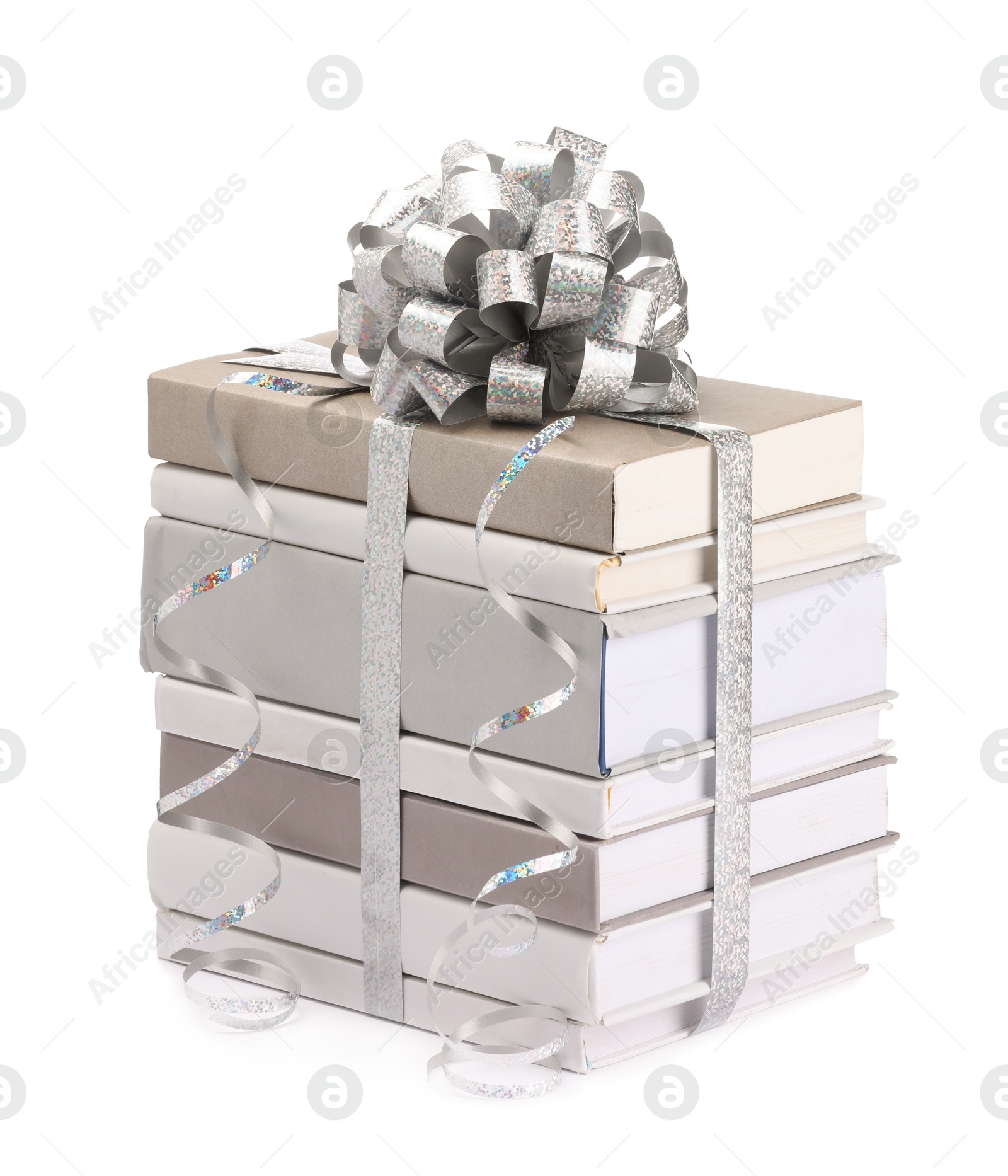 Photo of Stack of books with silver bow as gift isolated on white