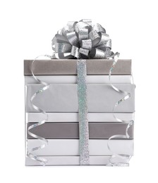 Photo of Stack of books with silver bow as gift isolated on white