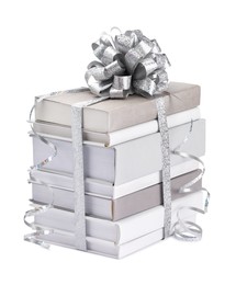 Photo of Stack of books with silver bow as gift isolated on white