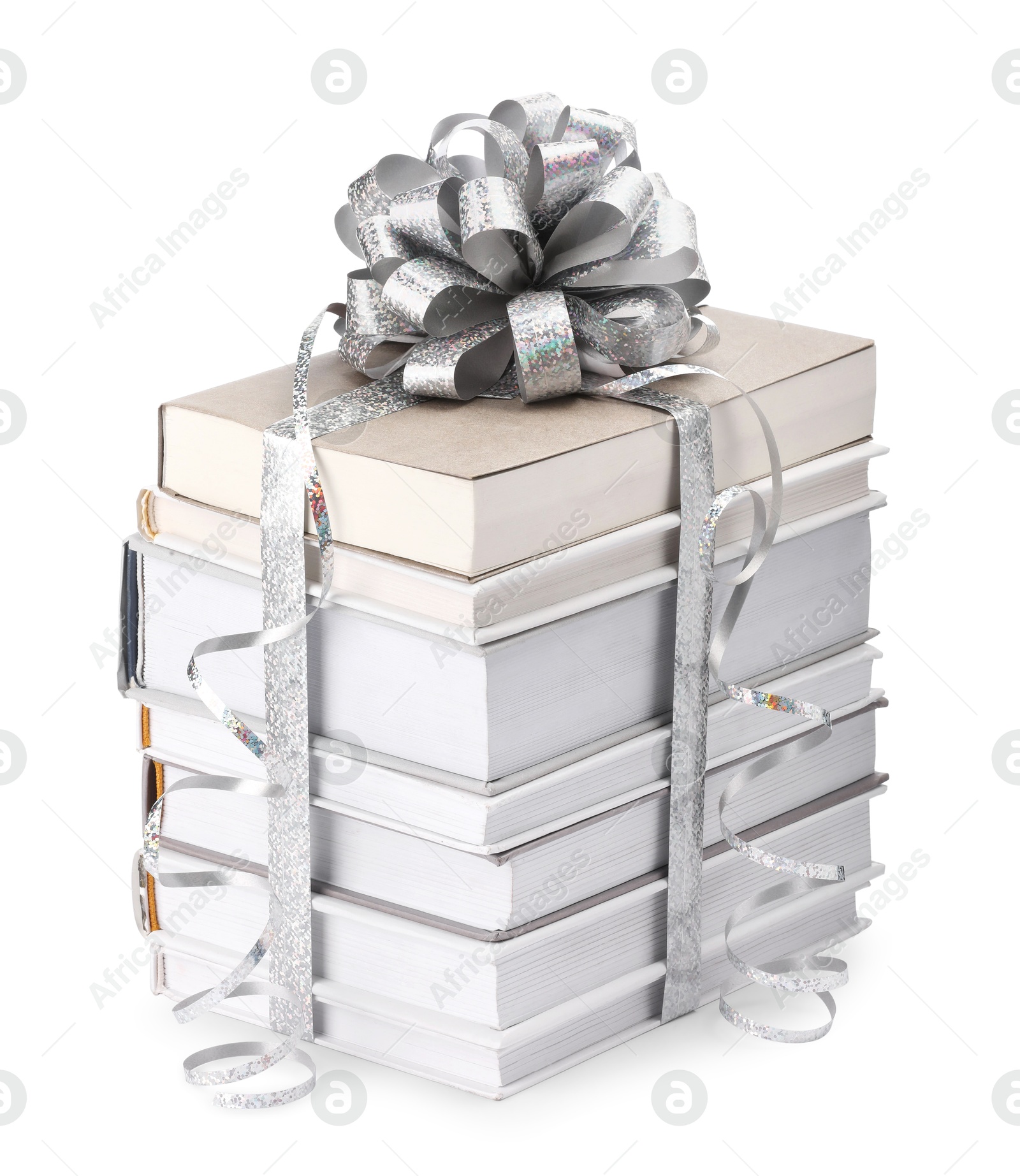 Photo of Stack of books with silver bow as gift isolated on white