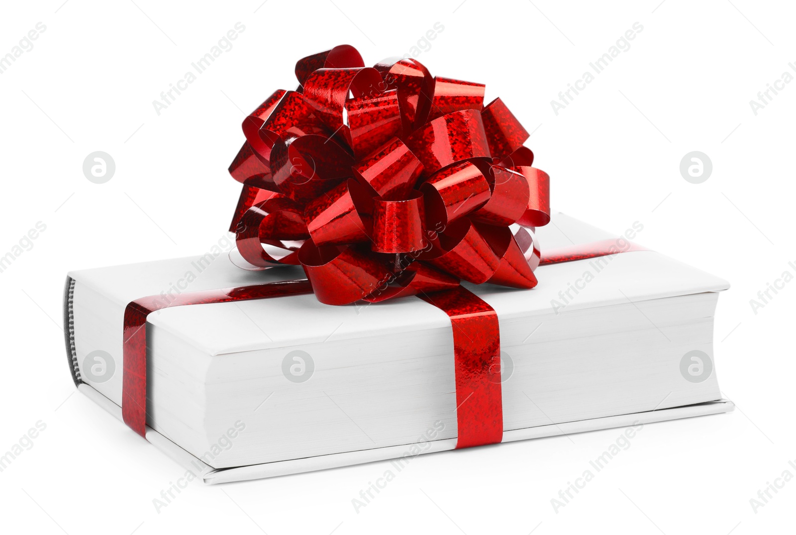 Photo of One book with red bow as gift isolated on white