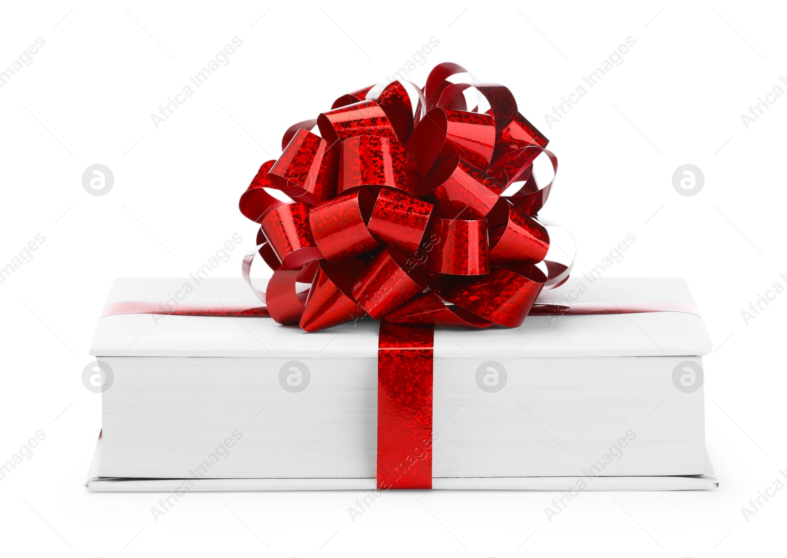 Photo of One book with red bow as gift isolated on white