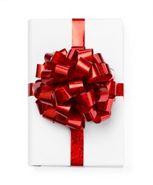 Photo of One book with red bow as gift isolated on white, top view