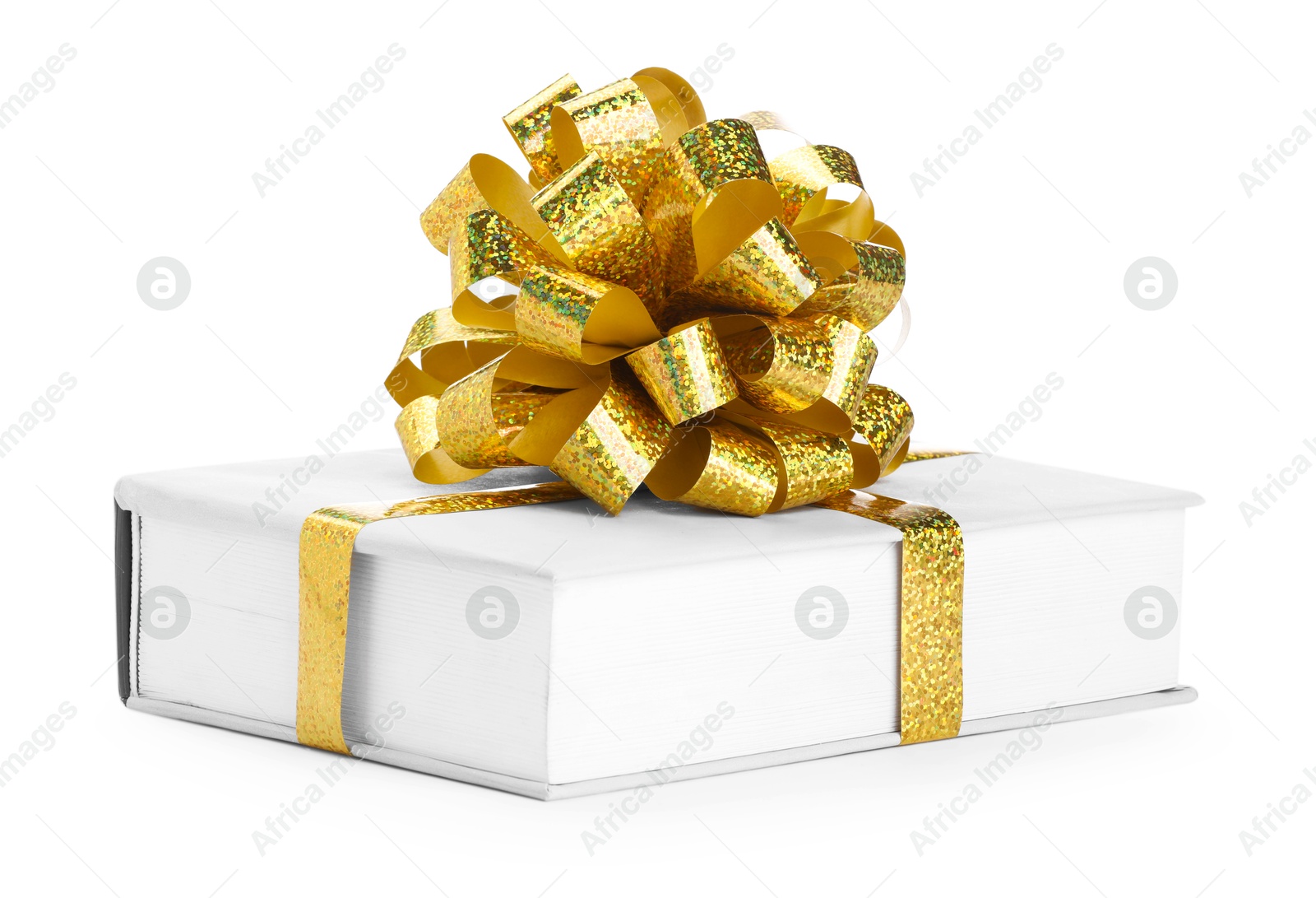 Photo of One book with golden bow as gift isolated on white