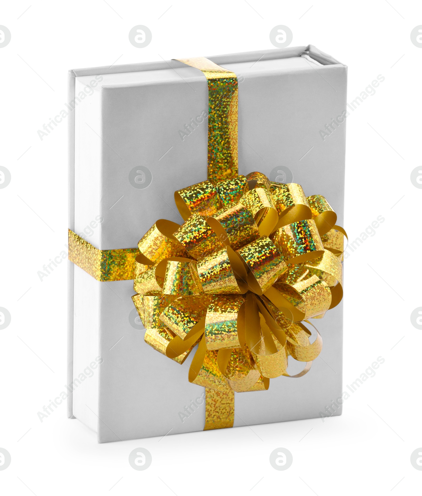 Photo of One book with golden bow as gift isolated on white