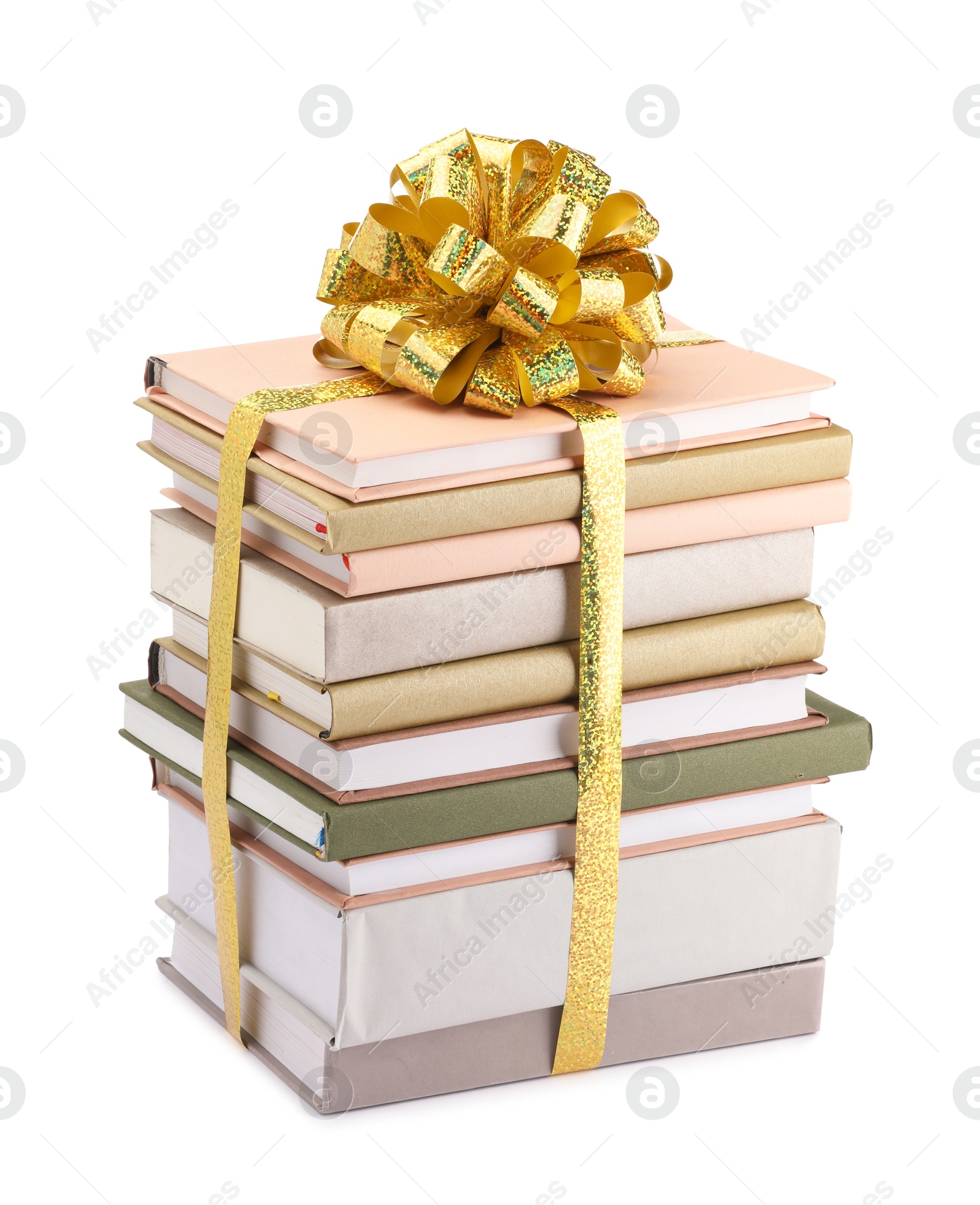 Photo of Stack of books with golden bow as gift isolated on white