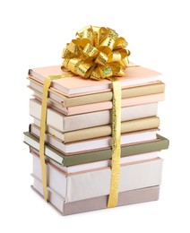 Photo of Stack of books with golden bow as gift isolated on white