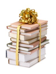 Photo of Stack of books with golden bow as gift isolated on white