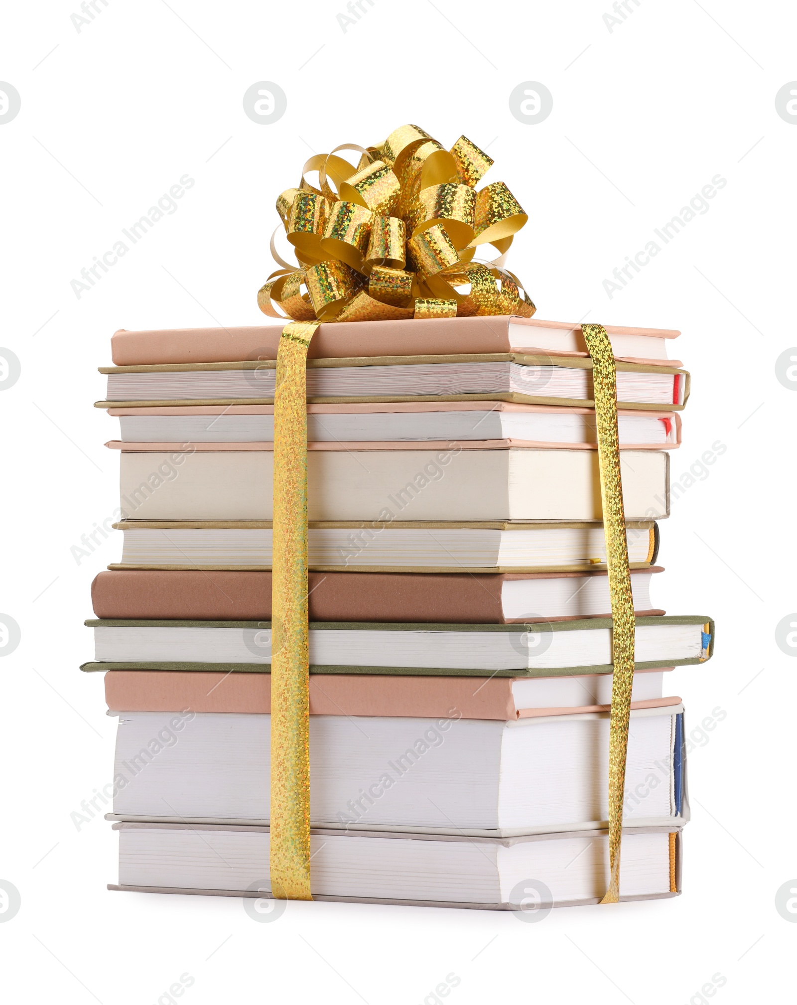 Photo of Stack of books with golden bow as gift isolated on white