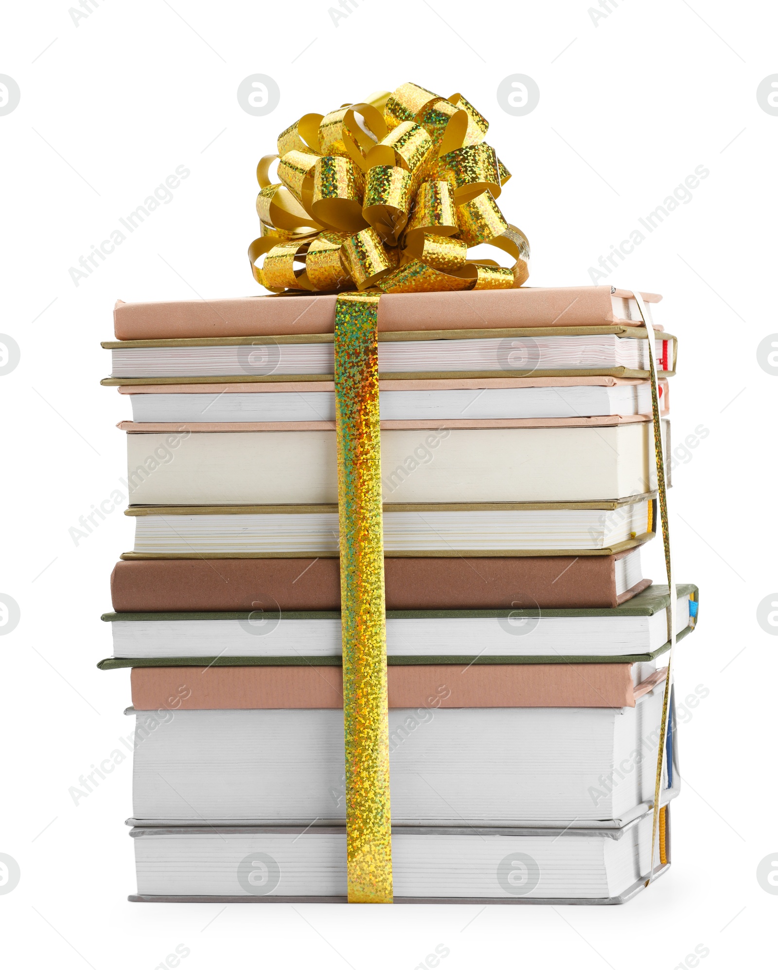 Photo of Stack of books with golden bow as gift isolated on white