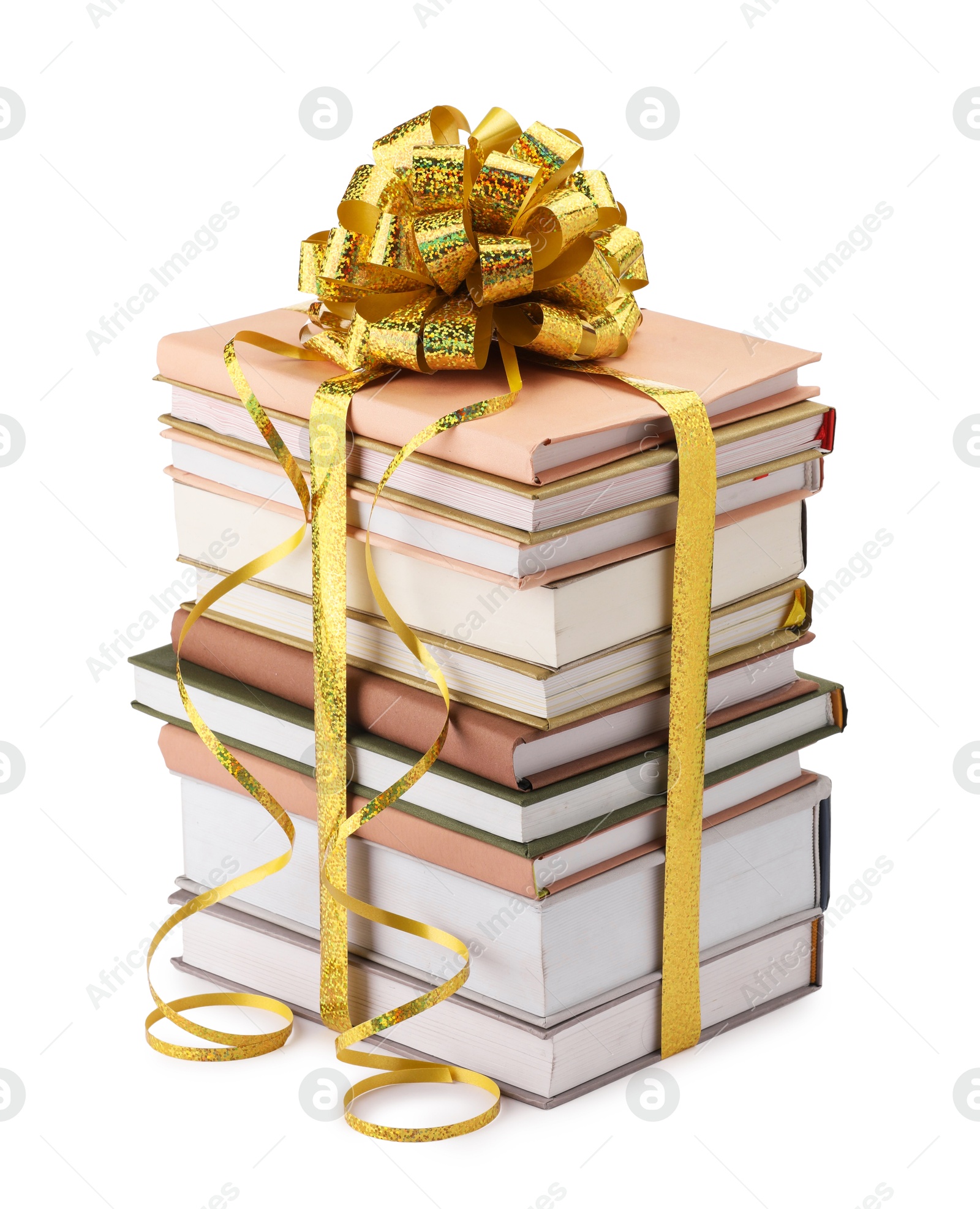 Photo of Stack of books with golden bow as gift isolated on white