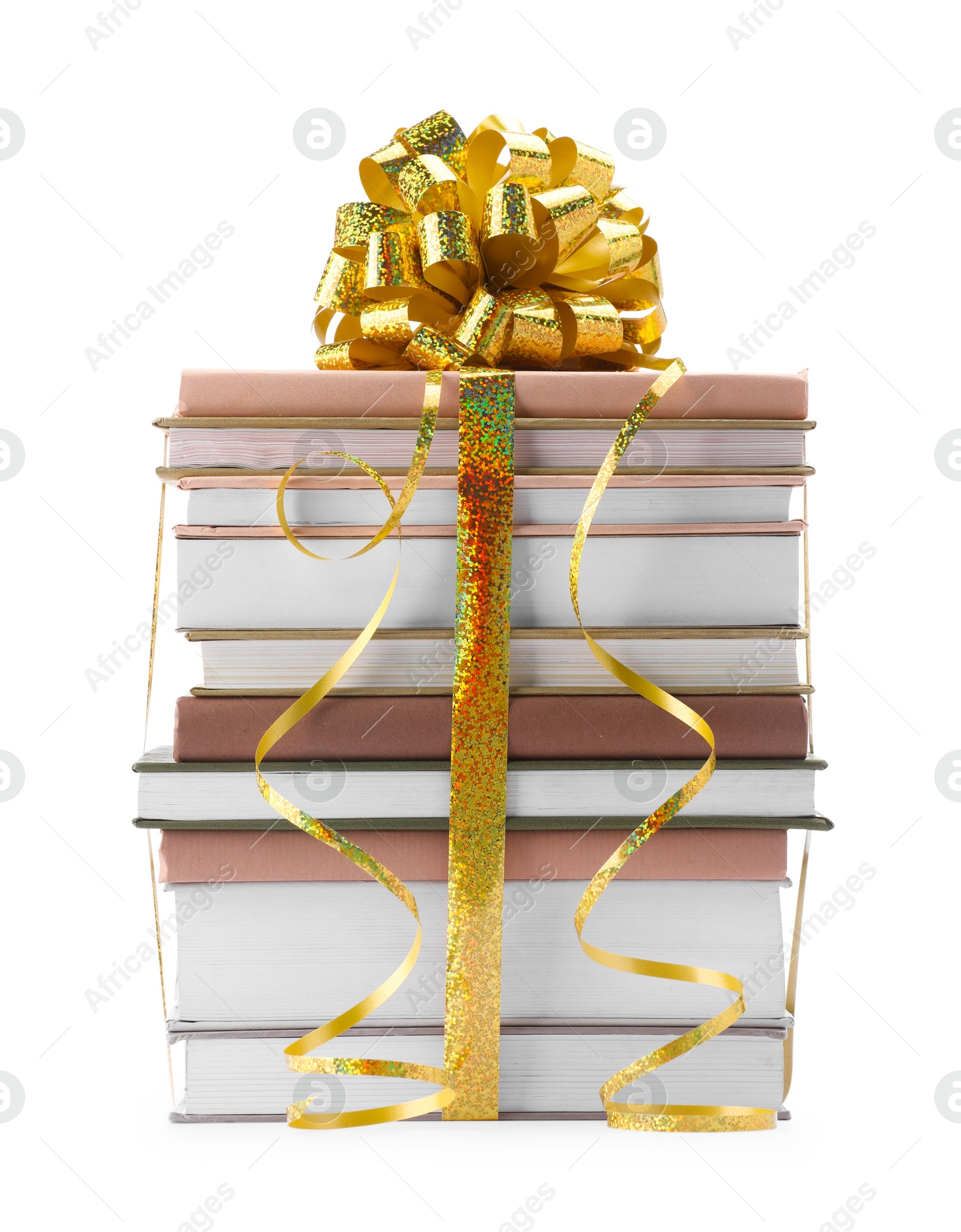 Photo of Stack of books with golden bow as gift isolated on white