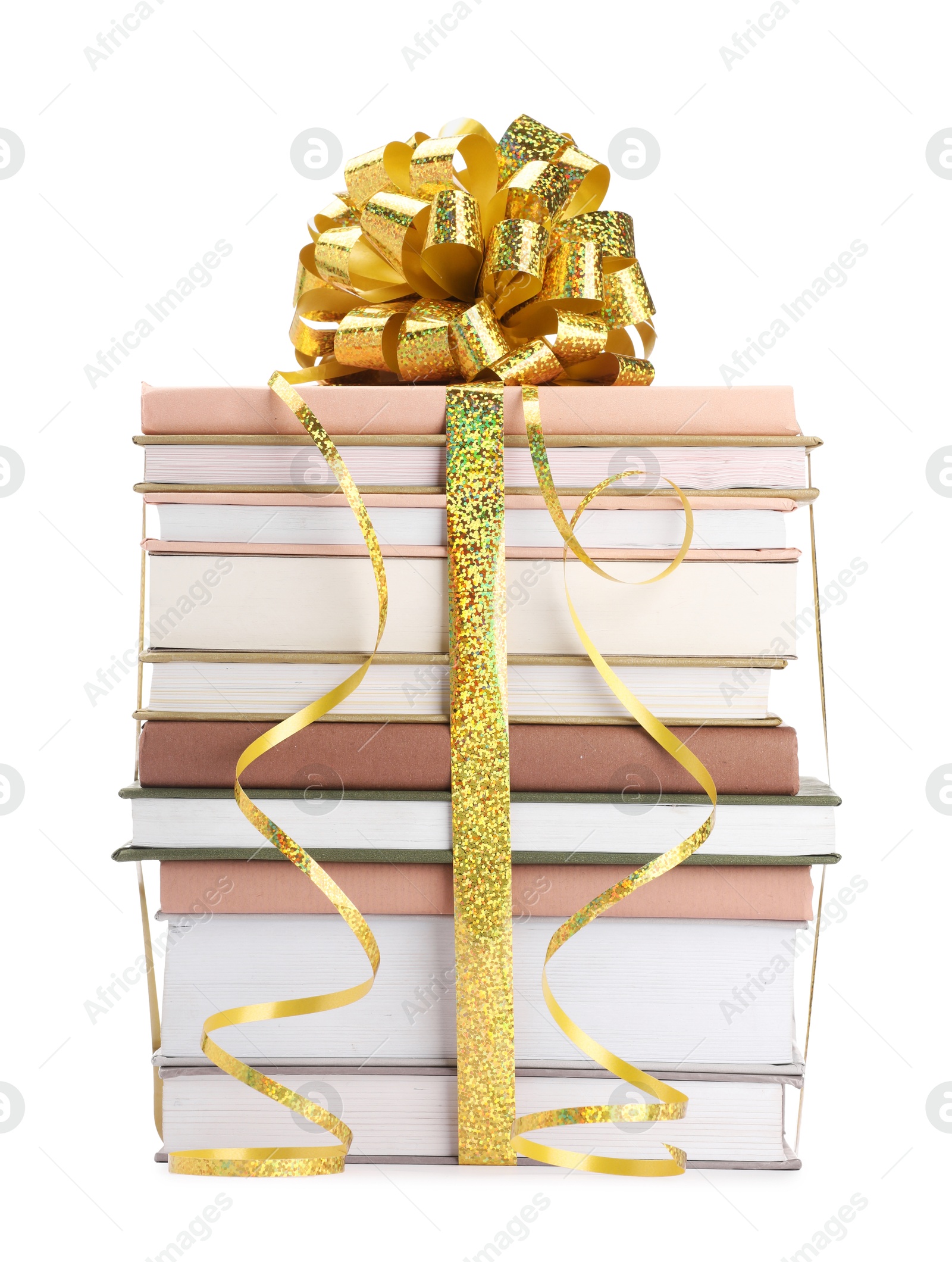 Photo of Stack of books with golden bow as gift isolated on white