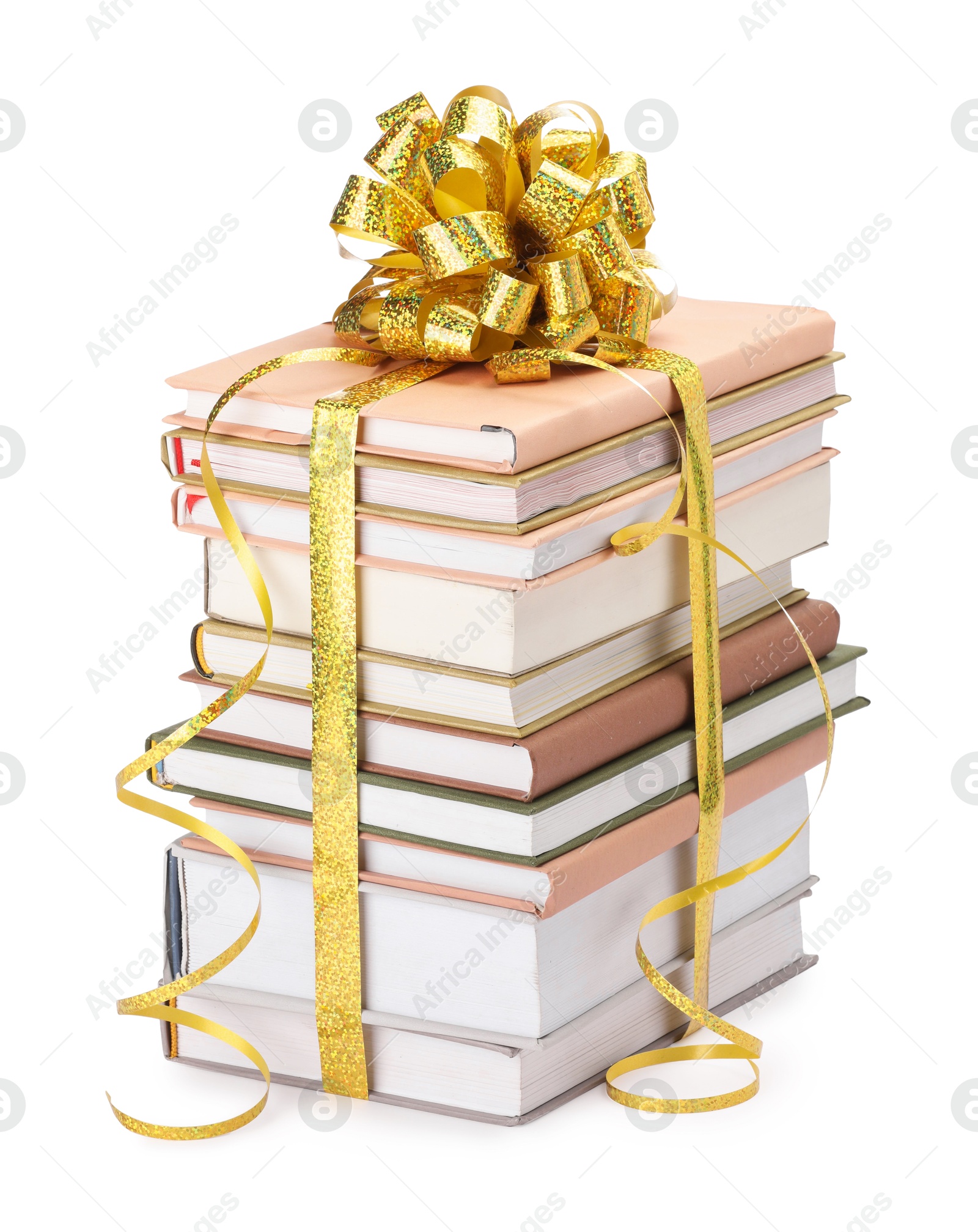 Photo of Stack of books with golden bow as gift isolated on white