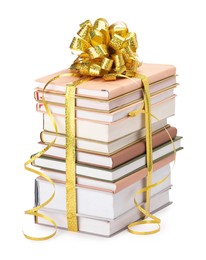 Photo of Stack of books with golden bow as gift isolated on white