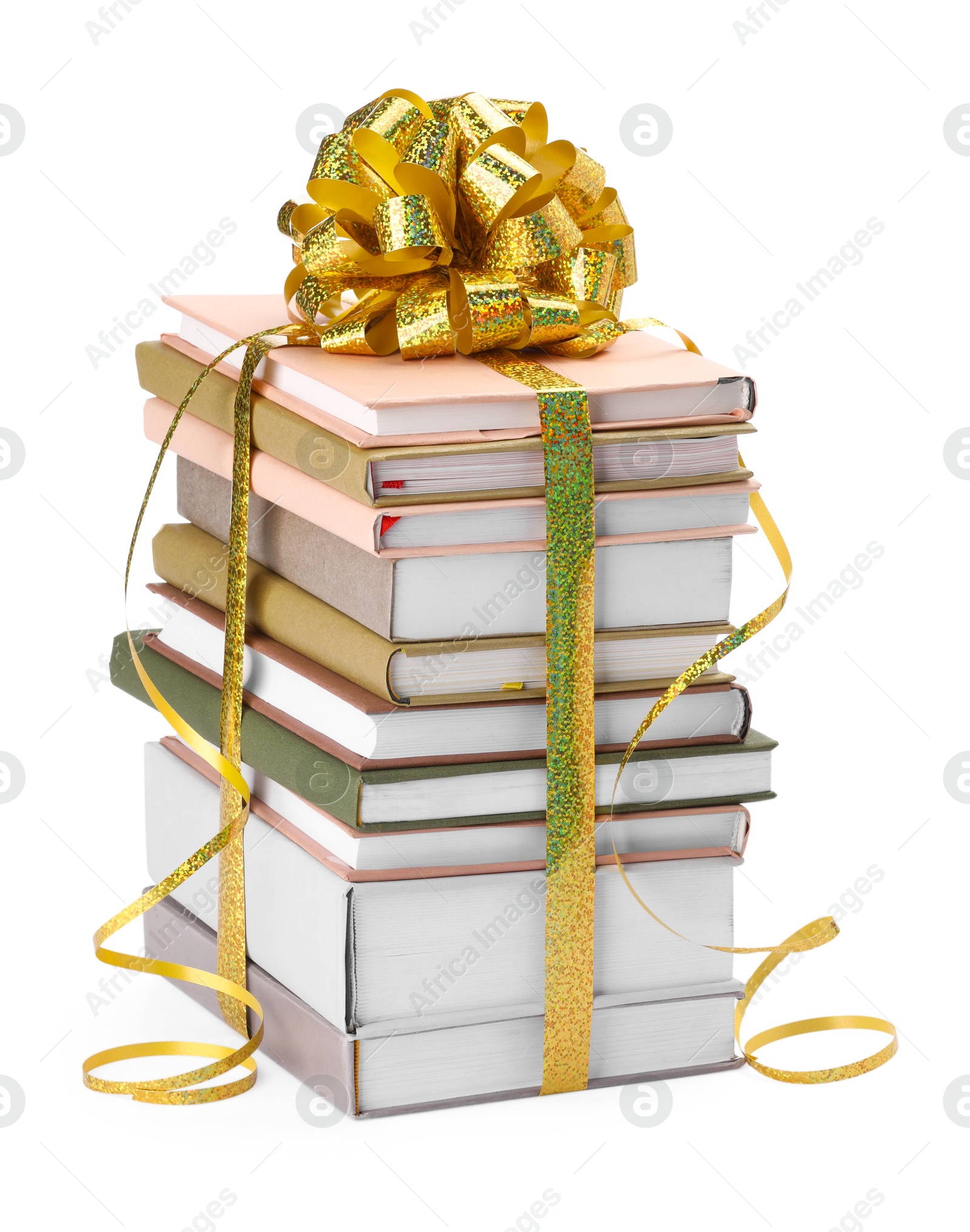 Photo of Stack of books with golden bow as gift isolated on white