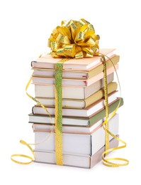 Photo of Stack of books with golden bow as gift isolated on white