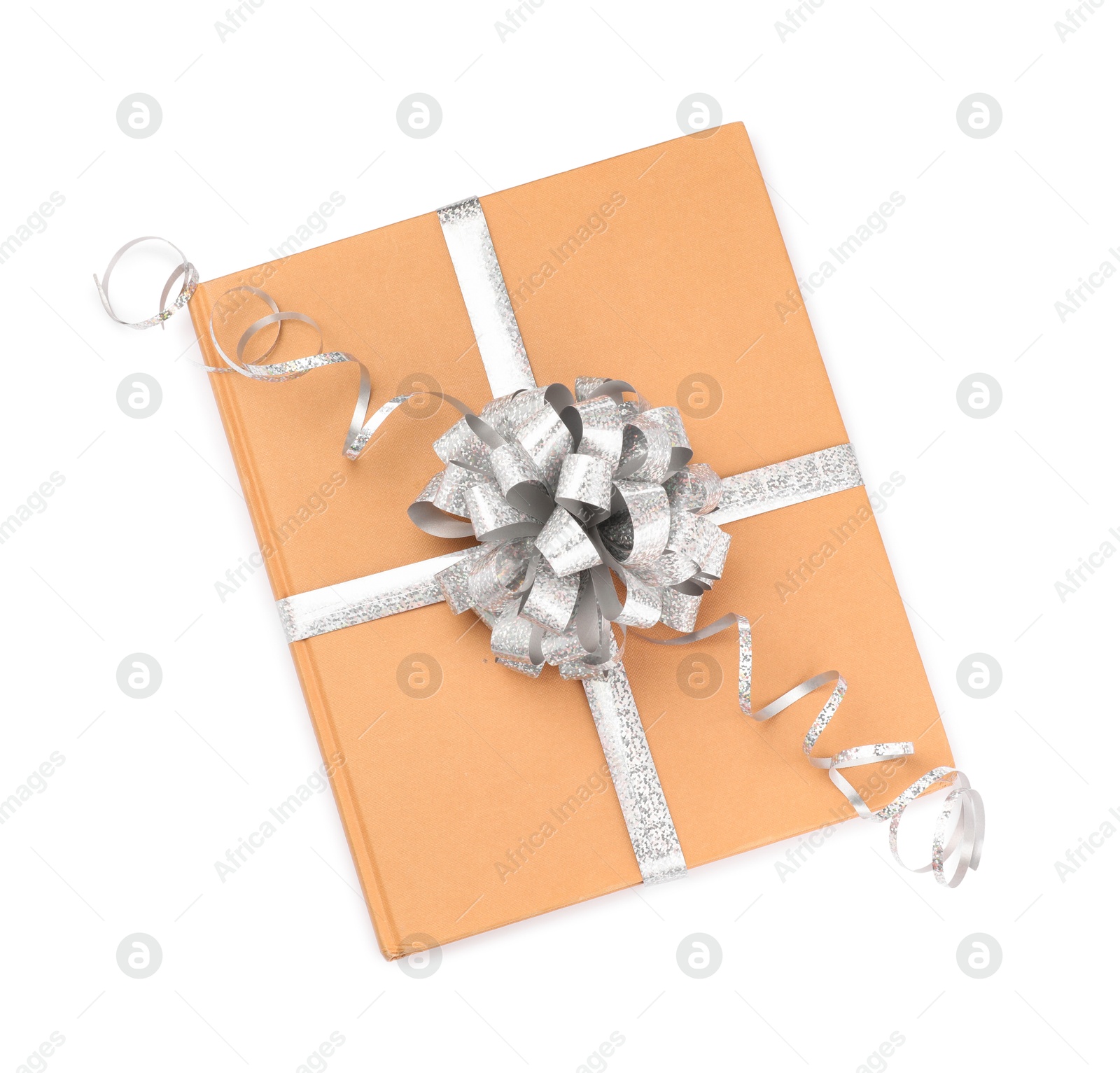 Photo of One book with silver bow as gift isolated on white, top view