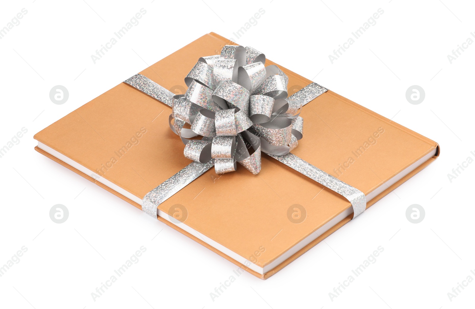 Photo of One book with silver bow as gift isolated on white