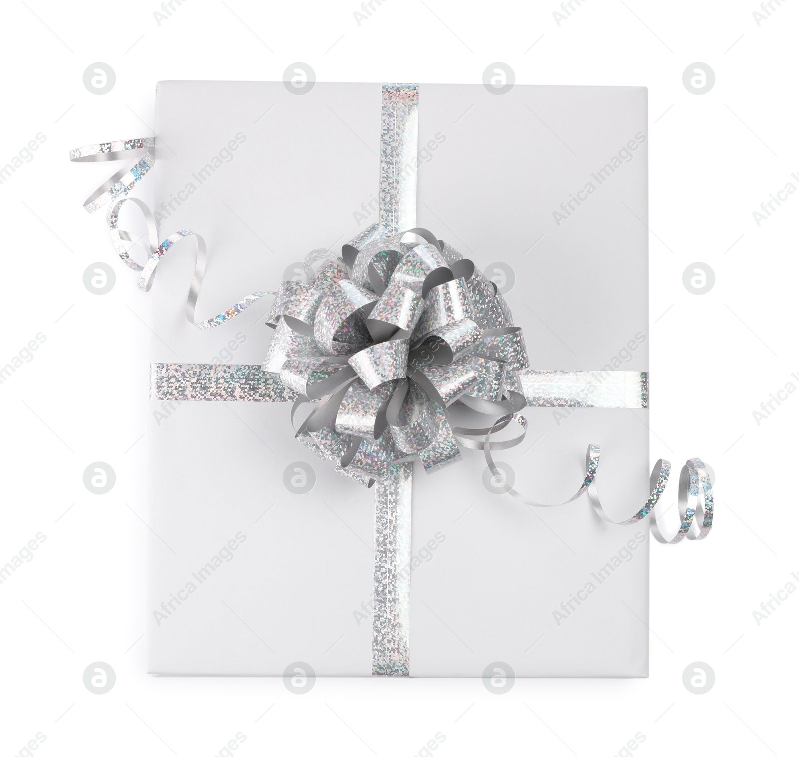 Photo of One book with silver bow as gift isolated on white, top view