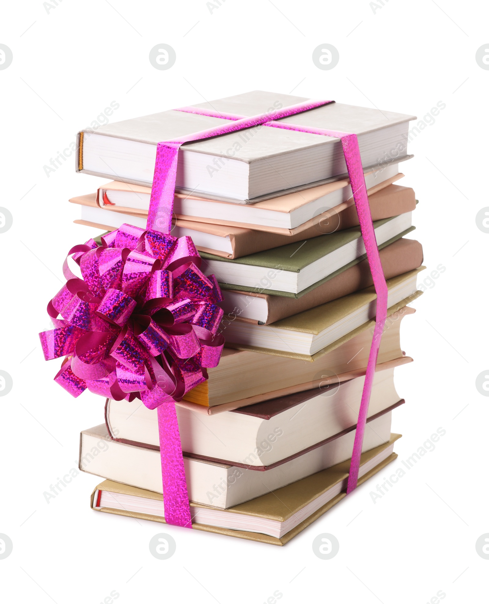 Photo of Stack of books with purple bow as gift isolated on white