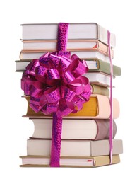 Photo of Stack of books with purple bow as gift isolated on white