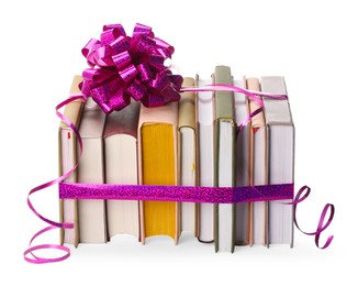 Photo of Books with purple bow as gift isolated on white