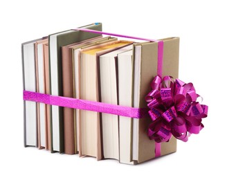 Photo of Books with purple bow as gift isolated on white