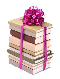 Photo of Stack of books with purple bow as gift isolated on white